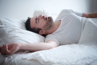 Man Sleeping In His Bed And Snoring