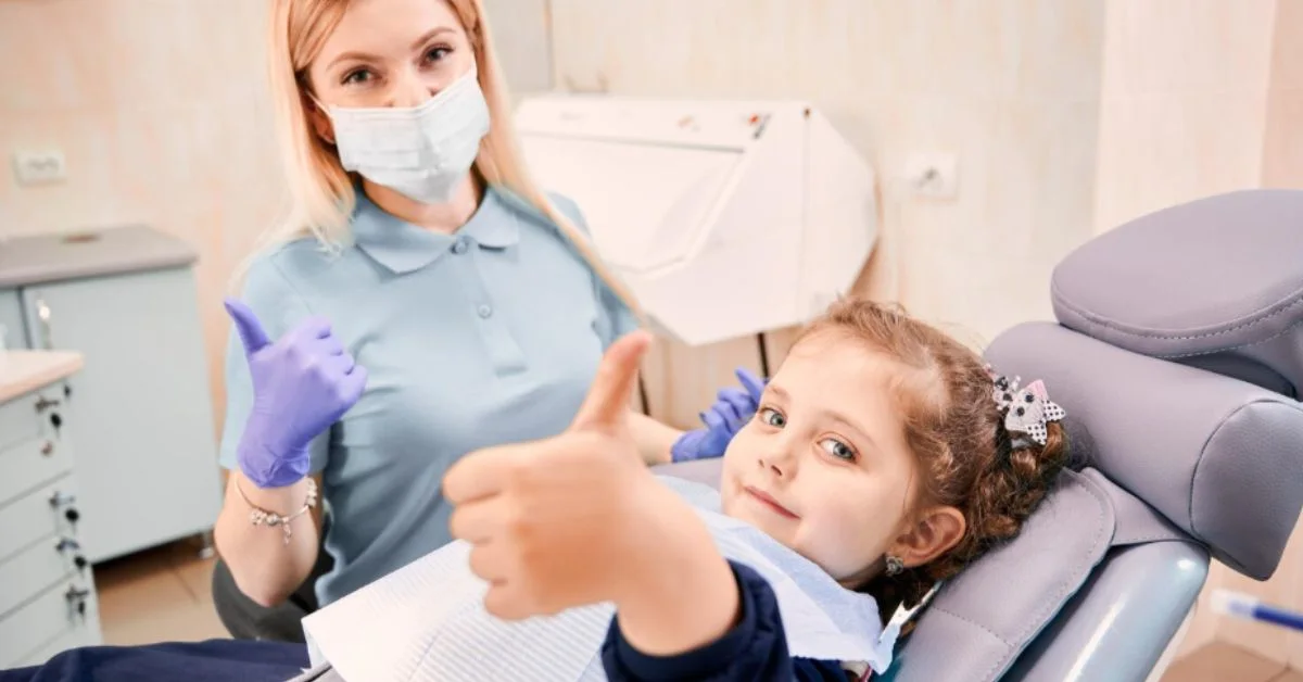 Childrens dentist visit cost in Roswell GA, child smiling in chair